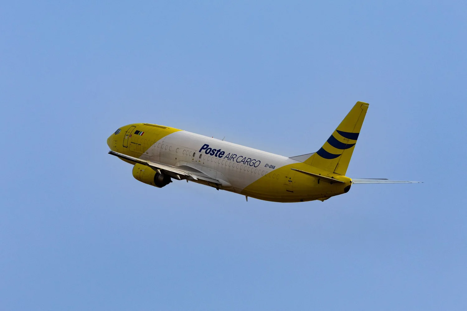 Air freight cargo pallets loaded onto plane at logistics terminal