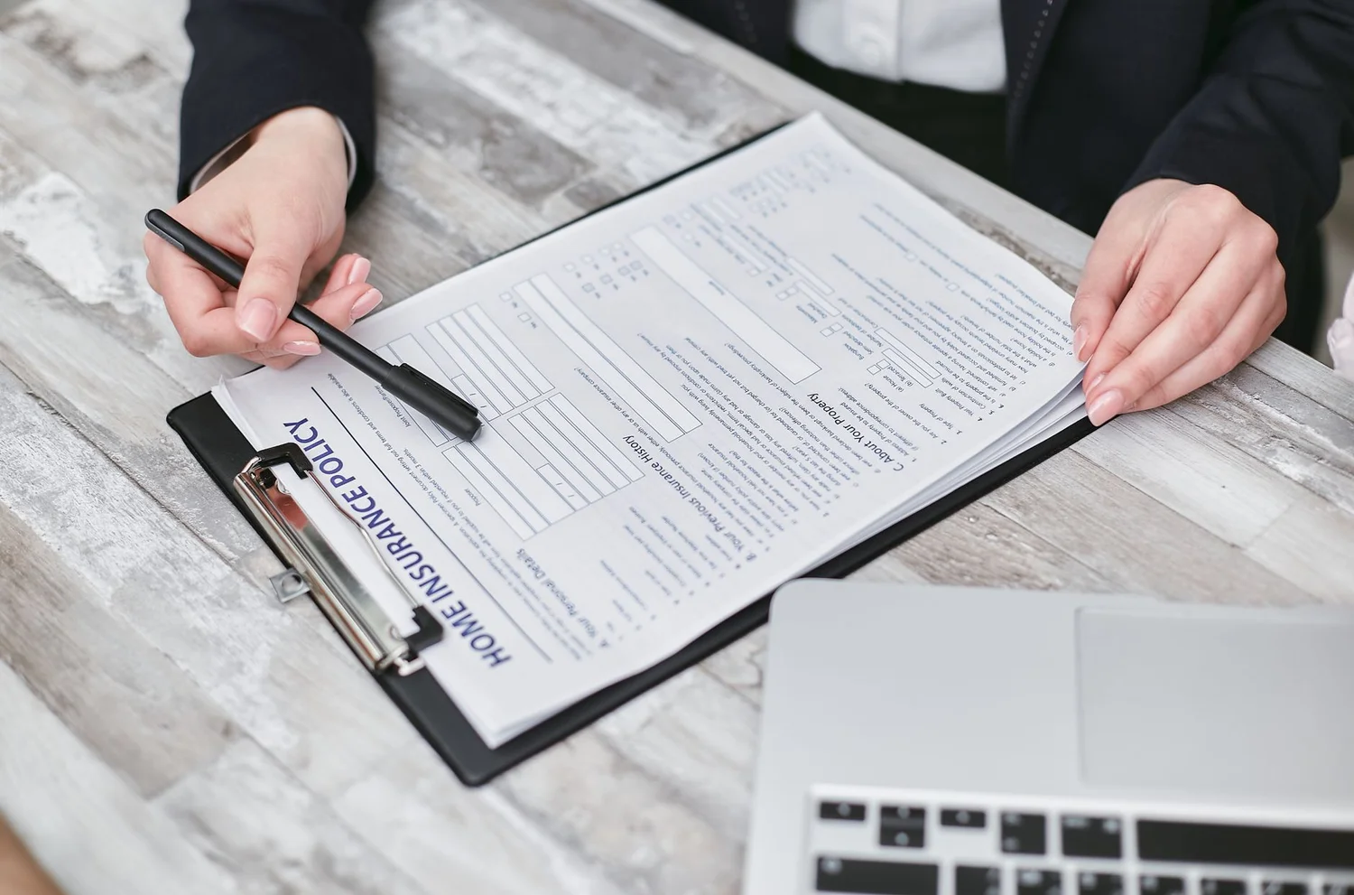 Amazon seller reviewing a suppressed listing enforcement notice on a laptop